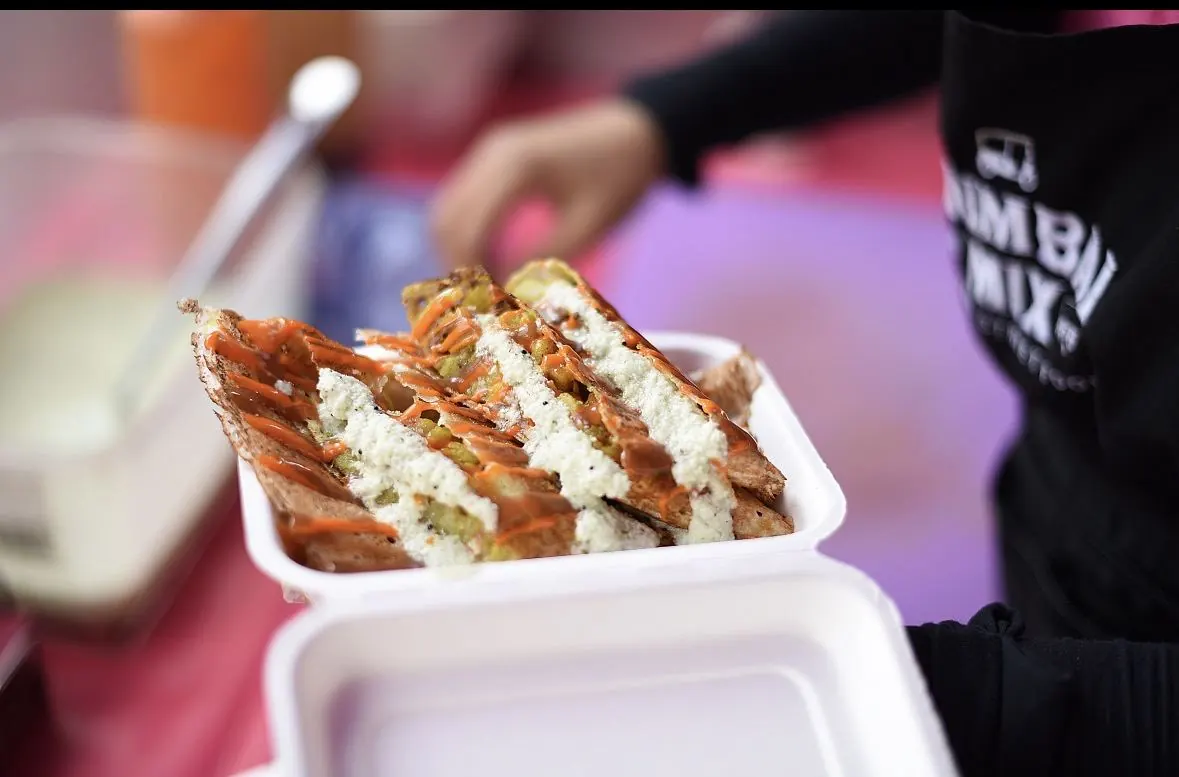 Mumbai Toastie sliced and served, showing the layered filling