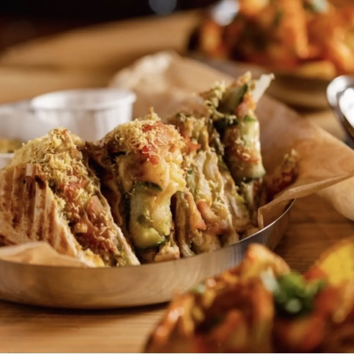 Mumbai Toastie sandwiches, filled with vegetables and topped with sev and chutney